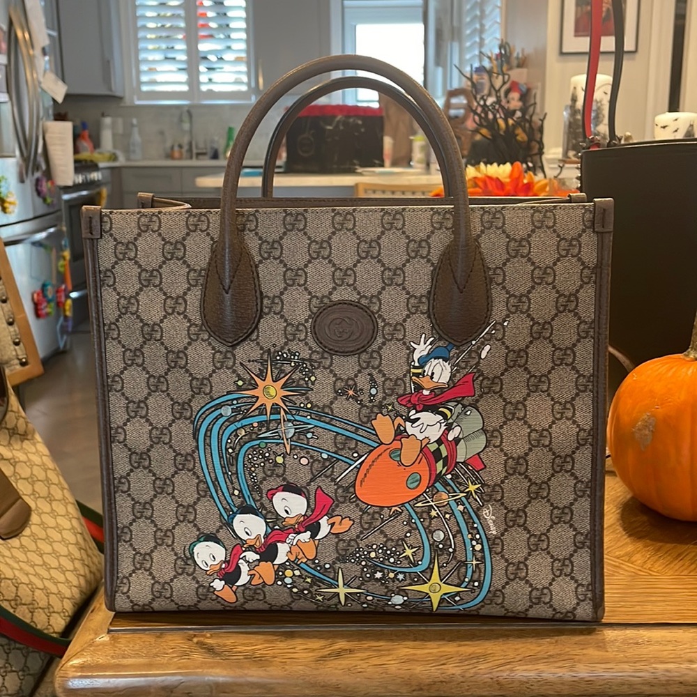 Gucci
Brown Print Disney Donald Duck Convertible Printed Gg Coated Canvas Tote